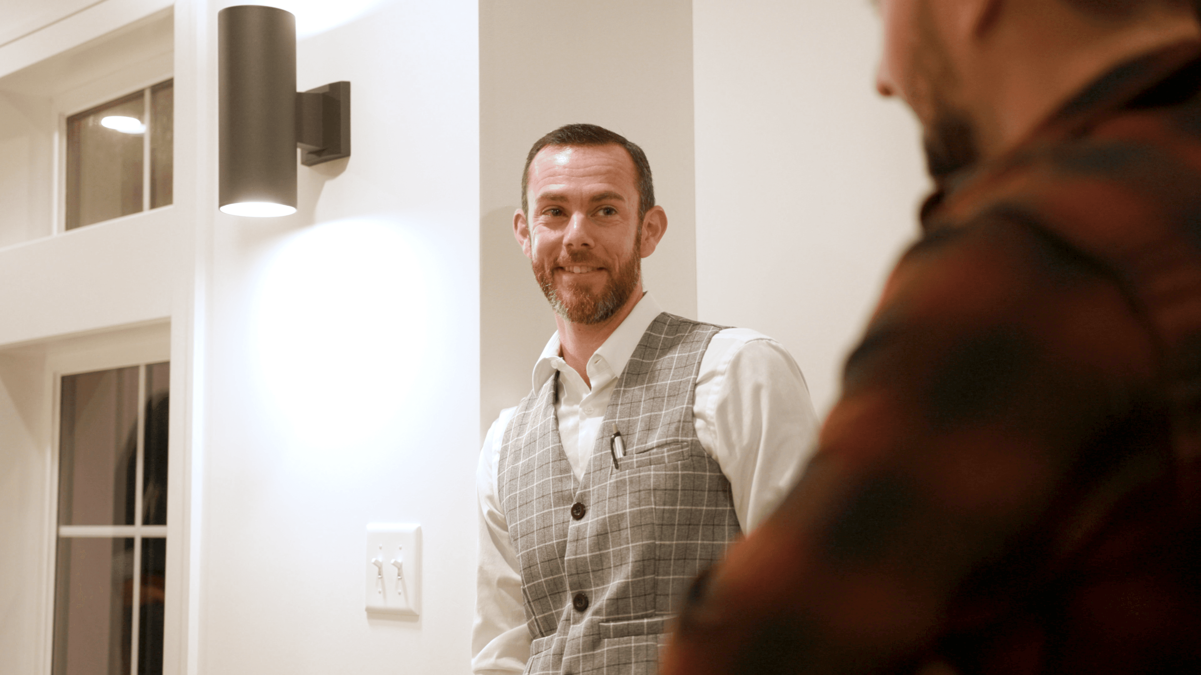 David Forster in a vest, conversational setting
