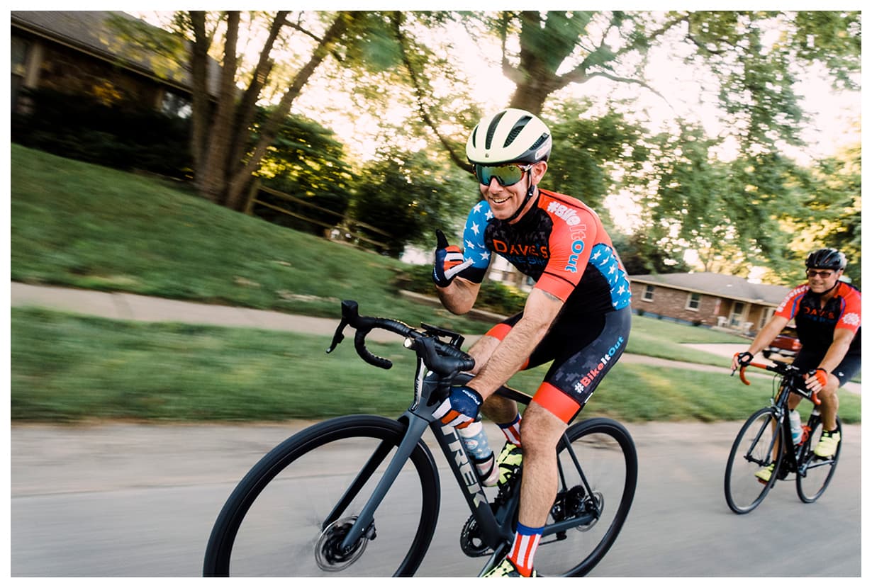 David Forster cycling at speed on a road bike